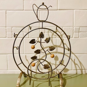 Vintage theekop en schotel caddy, decoratieve draadtheepot display en opberger, retro prop