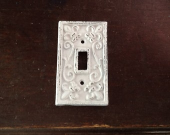 Victiorian style cast iron distressed white single light switch cover