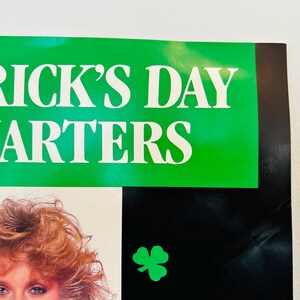 May include: A poster with the words "TRICK'S DAY QUARTERS" in white letters on a green background. A green shamrock is on a black background. A woman with red hair is visible.