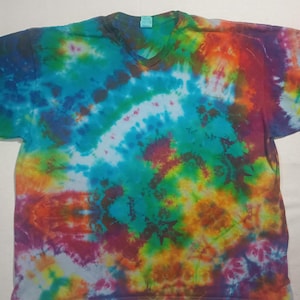 May include: A set of three ceramic mugs with a speckled, matte finish in cream, light grey, and dark grey. Each mug has a simple, minimalist design and a rounded handle. The mugs are stacked on top of each other.