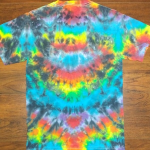 010 Adult Small  Black on Rainbow Ripple tie-dye shirt