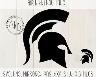 May include: Black and white silhouette of a Spartan helmet. The helmet is a popular symbol of strength and courage. The image also includes the text "air Nikki boutique" and "ANB".