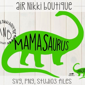 May include: Green dinosaur silhouette with the text "MAMA SAURUS" inside the body. A smaller dinosaur silhouette is mirrored and says "ZUAUAZAMAM". The text "Air Nikki Boutique" and "AND" are in a circle with leaves around it. The text "SVG, PNG, Studio3 files" is at the bottom of the image.