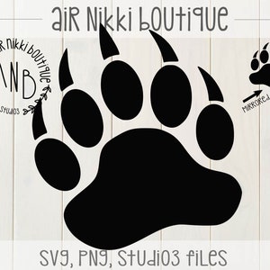 May include: Black bear paw print silhouette with five toes. The paw print is mirrored. The text "Air Nikki Boutique" is at the top of the image. The text "SVG, PNG, Studio3 files" is at the bottom of the image.