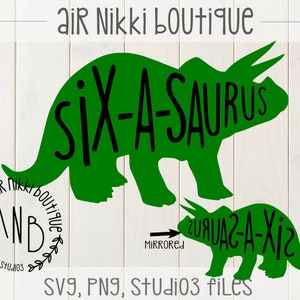 May include: Green silhouette of a triceratops with the text "Six-A-saurus" on it. Below is a smaller green silhouette of a triceratops with the text "Six-A-saurus" on it, but mirrored. The text "Air Nikki Boutique" is in the bottom left corner of the image.