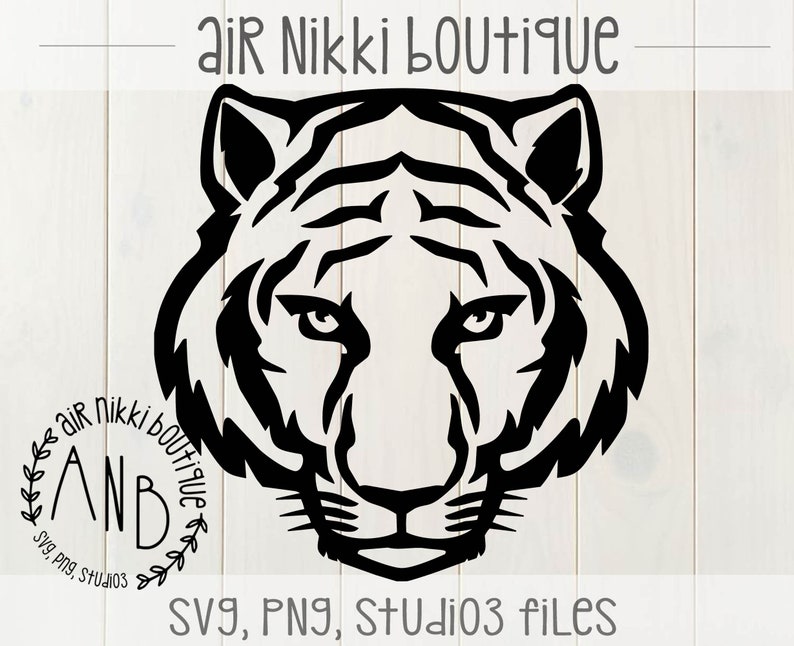 May include: Black and white silhouette of a tiger's head with a floral wreath around the text "Air Nikki Boutique" and "ANB" inside the wreath.
