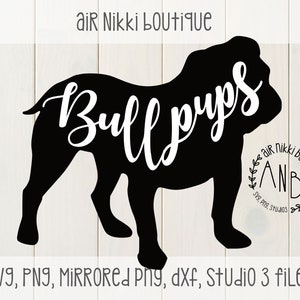 May include: Black silhouette of a bulldog with the text "Bull pups" written in white across the body. The image includes a small logo in the bottom right corner with the text "air Nikki boutique ANB SVG, PNG, Studios".