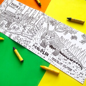 May include: A black and white coloring book page featuring illustrations of a tapir and a pangolin. The page includes the text "TAPIR" and "PANGOLIN". The text "PANGOLINS CAN EAT AROUND 70 MILLION INSECTS EVERY YEAR!" is also included.