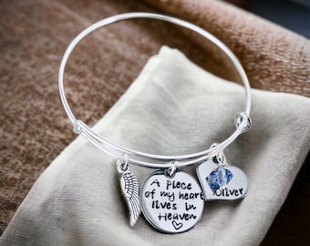 A piece of my heart lives in Heaven personalized bangle bracelet with various options available.