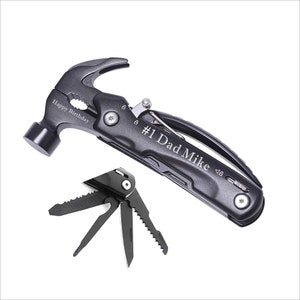 May include: Black multi-tool with a hammer head, pliers, and a saw. The tool is engraved with "#1 Dad Mike".