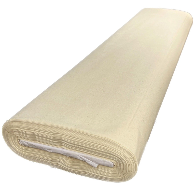 A long, white fabric roll with a folded edge, sitting against a white background.