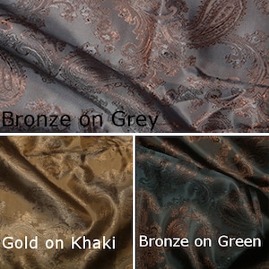 Pode incluir: Tr&ecirc;s amostras de tecido com padr&otilde;es paisley. A amostra superior &eacute; bronze sobre cinza. A amostra da esquerda &eacute; ouro sobre c&aacute;qui. A amostra da direita &eacute; bronze sobre verde.