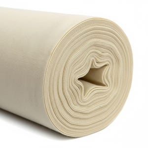 A close-up image of a beige, rolled-up fabric or material.