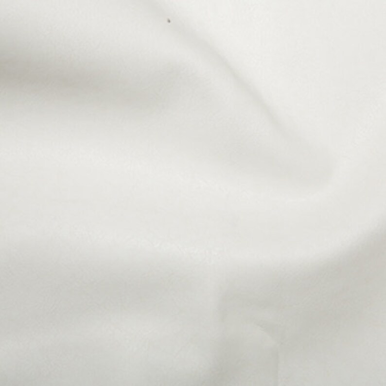 May include: A plain white fabric with a smooth texture.