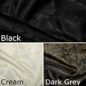 Pode incluir: Tr&ecirc;s amostras de tecido em preto, creme e cinza escuro. Cada amostra apresenta um padr&atilde;o paisley.