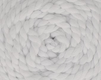 May include: Close-up of a white rope coiled in a spiral pattern. The rope is made of thick, twisted strands and has a soft, textured surface.