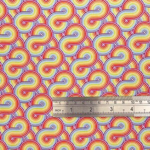 May include: A fabric with a repeating pattern of rainbow-colored swirls. The swirls are made up of thin, alternating stripes of red, orange, yellow, green, blue, indigo, and violet. The background is a light cream color.