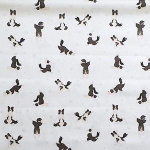 May include: White fabric with a repeating pattern of black and white border collie dogs in various yoga poses.