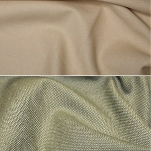 K&ouml;nnte beinhalten: Zwei Stoffmuster, eines beige und eines gr&uuml;n. Der beige Stoff ist glatt und der gr&uuml;ne Stoff hat eine strukturierte Webart.
