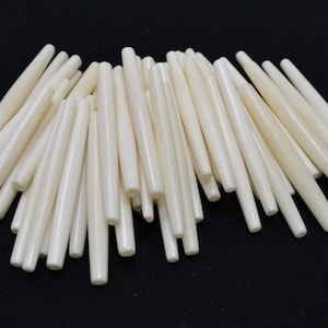 Perles tubulaires blanches en os de buffle 3"