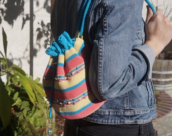 Patty's Reversible Crochet Backpack Pattern.  Made with cotton crochet thread and designed to be worn as a backpack or over the shoulder.