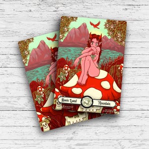 May include: Two fantasy art cards featuring a red-capped mushroom with white spots. A seated figure with red horns and hair is on the mushroom. The background shows a mountain landscape with red birds and the text "Basic Land Mountain".