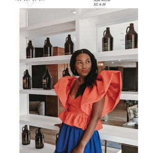 May include: A woman wearing an orange bustier top with exaggerated sleeves and a blue skirt. The image includes text that reads "BEAUTE' J'ADORE THE ART OF DIY" and "Women's exaggerated sleeve bustier top PDF Sewing Pattern Style #2250 SZ: 6-20."