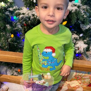 Dinosaur Carrying Christmas Tree Shirt. Christmas Shirt. Christmas Dinosaur Shirt. Holiday Shirt. Boys Christmas Shirt. Embroidered Shirt.