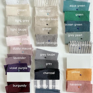 May include: A collection of fabric swatches in various colors, including white, cream, light grey, powder pink, lavender, burgundy, yellow, and sand. Each swatch is labeled with its color name.