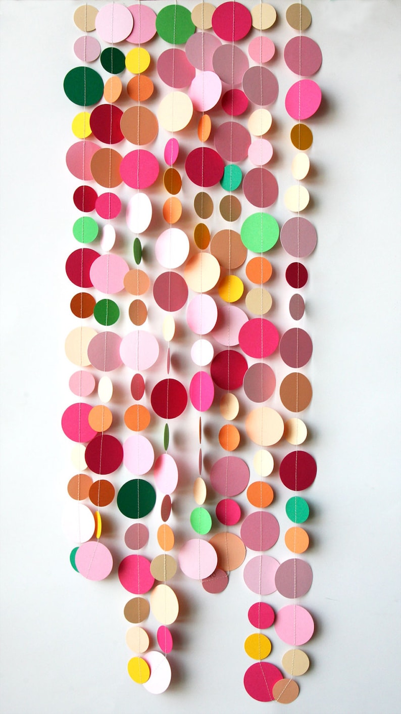 Soft pink and vibrant pink paper circles with pops of peach, orange, and bright yellow, handcrafted from FSC-certified cardstock.