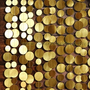 Gold Backdrop made with a set of 15x5 ft. long strings. (In person they are longer than the part that is pictured.)