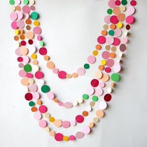 Delicate pink garland with accents of peach, orange, and bright yellow. Perfect for birthday parties and baby showers!