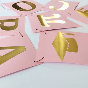 Graduation party decorations. Pink and gold Banner.