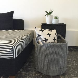 Grey storage round basket perfect for your living room blankets, pillows and magazine.