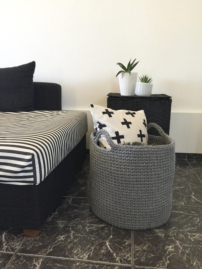 Grey storage round basket perfect for your living room blankets, pillows and magazine.