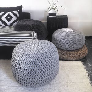 Stone grey round ottoman pouf.