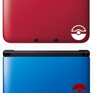 May include: Two Nintendo 3DS XL handheld gaming consoles. The top console is red with a white Pokeball logo. The bottom console is blue with a red Pokeball logo.