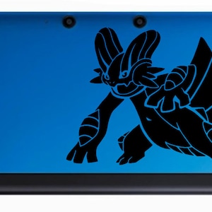 May include: A blue Nintendo 3DS handheld gaming console with a black silhouette of a Pokemon character on the top cover.