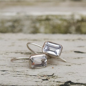 Emerald cut white topaz earrings in 9ct white gold