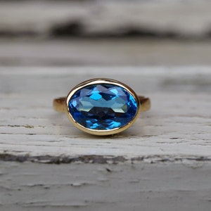 Recycled 18ct yellow gold blue topaz ring, large yellow gold blue topaz ring