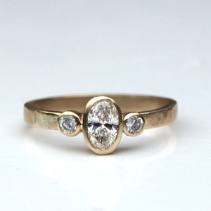 Diamond engagement ring;diamond trilogy ring; oval diamond ring