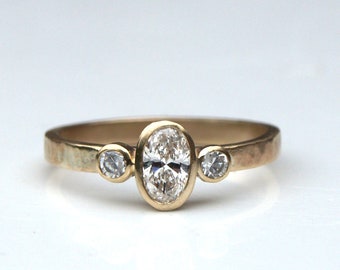 Diamond engagement ring;diamond trilogy ring; oval diamond ring