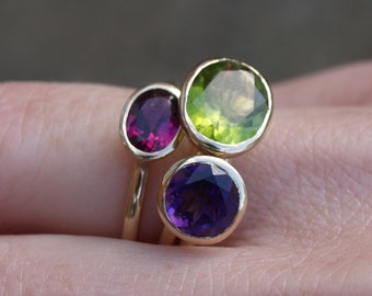 Recycled gold stacking rings; peridot, amethyst, garnet rings