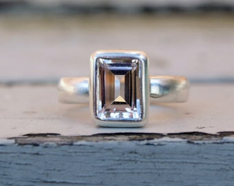 Emerald cut white topaz in recycled silver ring