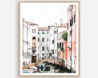 May include: Watercolor painting of a narrow canal in Venice, Italy. The canal is lined with colorful buildings and a small bridge crosses the water. There are boats docked along the canal.