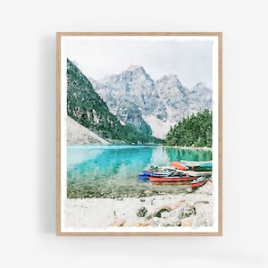 May include: Watercolor painting of a mountain lake scene with several colorful canoes docked on the shore. The lake is a vibrant turquoise blue, and the mountains are a soft gray with hints of green.
