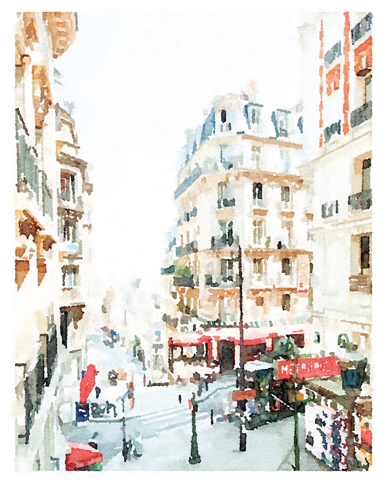 Puede incluir: Una pintura de acuarela de una escena callejera parisina con edificios, una cafeter&iacute;a y personas caminando. Los edificios est&aacute;n pintados en tonos de blanco y beige, con acentos rojos. La cafeter&iacute;a tiene un toldo rojo y un letrero que dice "METROPOLE".