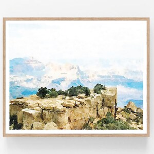 May include: A watercolor painting of a rocky cliff overlooking a vast, misty canyon. The cliff is covered in small trees and bushes, and the canyon is filled with layers of blue and white clouds. The painting is done in a soft, muted palette, and the overall effect is one of peace and tranquility.