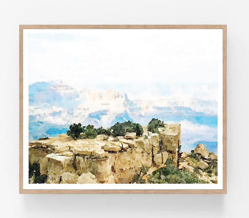 May include: A watercolor painting of a rocky cliff overlooking a vast, misty canyon. The cliff is covered in small trees and bushes, and the canyon is filled with layers of blue and white clouds. The painting is done in a soft, muted palette, and the overall effect is one of peace and tranquility.