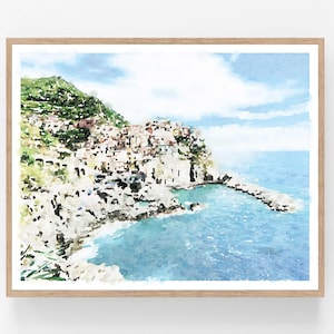 K&ouml;nnte beinhalten: Ein Aquarellbild einer K&uuml;stenstadt, die in eine Klippe gebaut ist. Die Stadt ist in Rosa-, Gelb- und Wei&szlig;t&ouml;nen gemalt, mit einem blauen Meer im Vordergrund. Der Himmel ist hellblau mit wei&szlig;en Wolken.